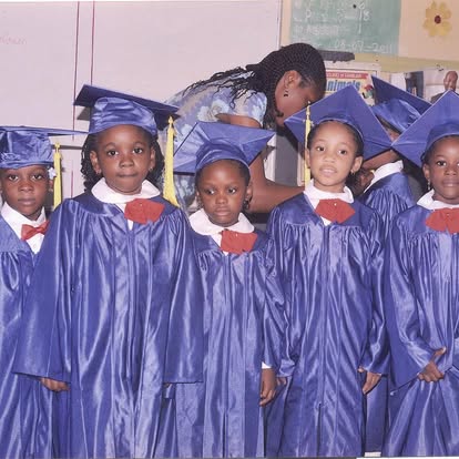 Pre-school graduation in blue gowns and caps