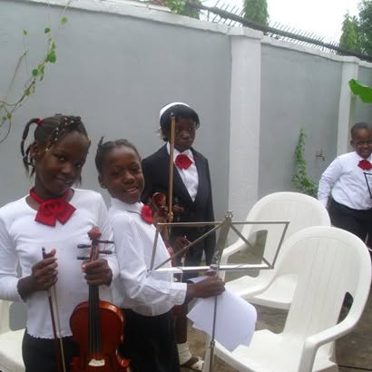 Children performing on violins, Speech and Prize Giving Day 2011